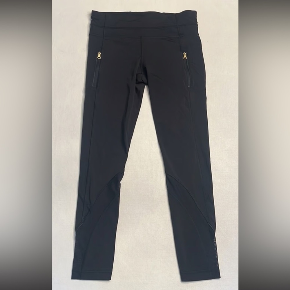Lululemon Black Leggings with Gold Zipper Accents